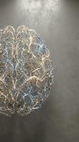 Golden glittery brain with neural network connections on gray background for medical education, neuroscience research and cognitive health concepts.