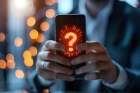 Person holding smartphone with glowing red question mark on screen, bokeh lights in background. Perfect for technology support, FAQ, customer service concepts.