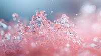 Delicate pink crystal formations with soft bokeh effects create dreamy macro photography composition against blurred turquoise background, showcasing nature's frozen moments.