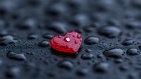 Red heart with water drops on dark surface, romantic mood concept with selective focus and bokeh effect, macro photography for Valentine's day cards and love themes.