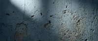 Weathered concrete surface with scattered debris, cracks, and natural aging marks, suitable for backgrounds, textures, and industrial design projects.