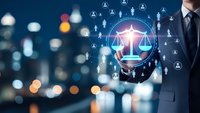 Professional businessman holding glowing justice scales with network connections representing legal technology and digital law services.