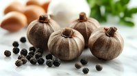 Fresh brown pumpkins with scattered black peppercorns on white marble surface, eggs and green herbs in background, food photography composition.