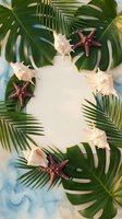 Tropical frame with palm leaves, seashells and starfish on white background for summer vacation design and travel marketing materials.