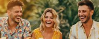 Young diverse friends laughing together outdoors on sunny day, showing genuine joy and happiness during casual summer gathering. Natural candid moment.