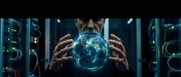 Businessman holding glowing digital earth globe in modern data center server room with blue lighting for technology and global business concepts.