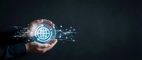 Businessman holding glowing digital globe with network connections in hands against dark background for technology and global business concepts.