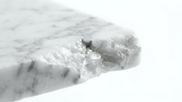 Closeup of crushed ice or frozen water with crystalline texture and white frosted surface against neutral background for winter and cold concepts.