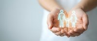 Hands protecting glowing family figures symbolizing care, insurance coverage, health protection and social support services for loved ones.