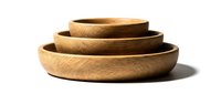 Wooden bowls stacked in graduated sizes, crafted from natural wood with warm grain texture, isolated on white background for design and product mockup use.