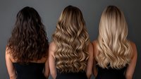 Three women with different hair colors and textures showing long wavy hairstyles from behind, displaying brunette, caramel blonde and platinum blonde shades against dark background.