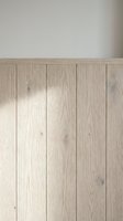 Light oak wood paneling with vertical planks and natural grain texture against neutral wall background, suitable for interior design, home renovation, and architectural visualization projects.