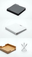 Modern office desk accessories collection featuring black notebooks, white binder, wooden tray and metal stand isolated on white background for business design.