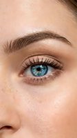 Close-up of woman's blue eye with natural makeup, long eyelashes and shaped eyebrow. Beauty skincare and cosmetics concept for wellness advertising.