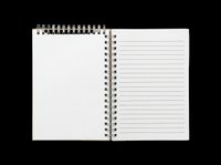 Spiral bound notebook with blank left page and lined right page, isolated on transparent background, ready for clipart, print-on-demand, sublimation, t-shirt design, and sticker applications.