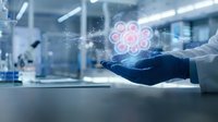 Scientist in white coat and blue glove holds glowing digital cell hologram in modern laboratory, representing biotech innovation.