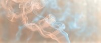 Abstract flowing smoke wisps in soft pastel colors creating ethereal atmospheric background for meditation, wellness and relaxation design projects.