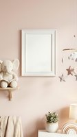 Blank white frame mockup on pastel pink nursery wall with elephant toy, star mobile, and wooden decor for art print presentation.