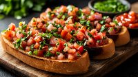 Fresh bruschetta with diced tomatoes, garlic, and chopped herbs on toasted bread slices served on wooden cutting board, traditional Italian appetizer.