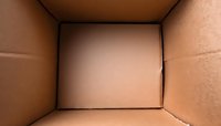 Inside view of empty cardboard box showing brown corrugated walls and corners, minimalist composition with natural lighting gradient for packaging and shipping concepts.