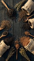 Assorted organic grains and legumes in burlap sacks with wooden spoons on rustic dark wood background for healthy cooking and nutrition concepts.