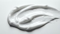 Smooth white cream or lotion texture with glossy finish on isolated background, suitable for cosmetics, skincare, and beauty product packaging design.
