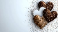 Romantic hearts made of scattered coffee grounds and cocoa powder on white background with copy space, creating elegant Valentine's day composition.
