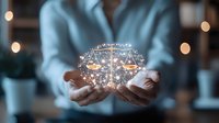 Glowing digital brain with scales of justice floating above female hands, symbolizing artificial intelligence in legal technology and digital law innovation.