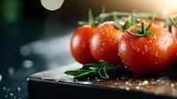 Fresh ripe tomatoes with water drops on dark wooden cutting board, close up view with selective focus and natural lighting. Organic produce concept.