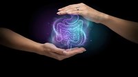 Hands protecting glowing digestive system hologram on dark background for medical healthcare and wellness concepts.