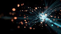 Glowing blue fiber optic strands emit bright light rays with orange bokeh effects against dark background, creating dynamic technological abstract pattern.
