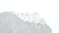 Minimalist mountain ridge with snow-covered peaks against overcast sky, suitable for backgrounds, nature themes, and minimalist design projects.