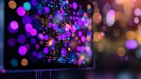 Digital data stream with glowing purple and blue bokeh lights on computer screen, abstract technology background showing binary code and programming text.