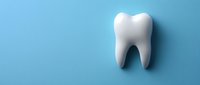White tooth model on blue background with shadow, representing dental care, oral hygiene, and dentistry concepts for healthcare marketing.