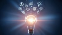 Glowing light bulb with business icons floating above representing innovation, creativity, and entrepreneurial ideas on dark blue background.