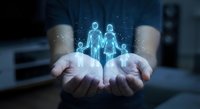 Hands holding glowing holographic family figures with digital particles, representing protection, insurance, healthcare and social services technology.