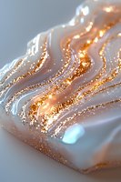 Luxurious white marble texture with flowing gold glitter waves creates elegant abstract pattern. Shimmering metallic streaks on pearly surface for luxury designs.