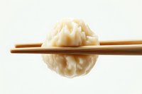Steamed dumpling held by wooden chopsticks against white background, showcasing traditional Asian cuisine for food photography and menu design.