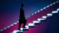 Silhouetted male professional climbing illuminated staircase against vibrant purple and blue gradient background, representing career advancement, business growth, and success in corporate environment.