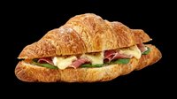 Croissant sandwich with ham, cheese, and fresh greens isolated on transparent background. Ready for menus, food blogs, restaurant designs, print materials, and culinary marketing projects.