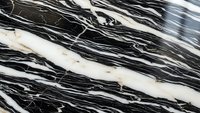 Luxurious black marble texture with dramatic white and gold veining patterns for premium interior design and architectural applications.