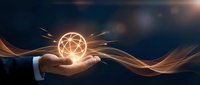 Businessman holding glowing geometric sphere with light rays and flowing energy waves against dark background, representing innovation, technology, and business solutions.
