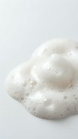 White foamy soap bubbles on clean background for skincare and hygiene products advertising and cosmetic industry marketing materials.
