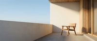 Wooden chair on sunny minimalist terrace with concrete wall and modern architecture, ideal for interior design and lifestyle concepts.