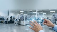 Hands interacting with holographic digital interface displaying global network connections in modern industrial manufacturing facility.