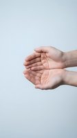 Open cupped hands gesture on clean white background showing palms ready to receive or give, symbolizing care, support, protection and generosity concepts.