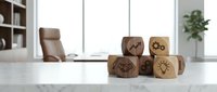 Wooden cubes with business icons on modern office desk. Corporate strategy, planning and development concept for presentations and marketing materials.
