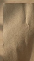 Brown kraft paper texture with natural fibers and organic surface for packaging design and eco-friendly branding projects.