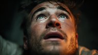 Young man with tears streaming down face showing intense emotional pain and vulnerability in dramatic lighting for mental health awareness campaigns.