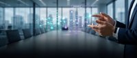 Businessman using holographic interface technology in modern office with digital data visualization and futuristic network connections for innovation.